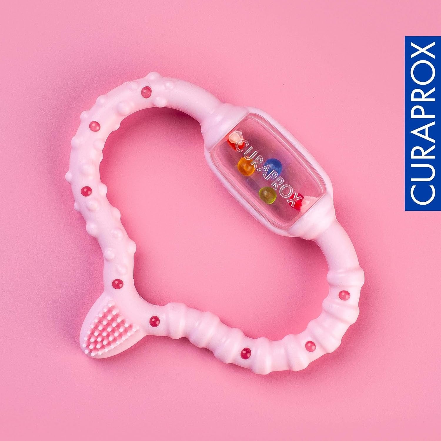 Anneau de dentition Curaprox pour bébés - Pour tout-petits 0-24 mois/Soulage la douleur dentaire et favorise les compétences motrices | Sans BPA, Rose, avec brosse à dents d'entraînement/Fabriqué en Suisse