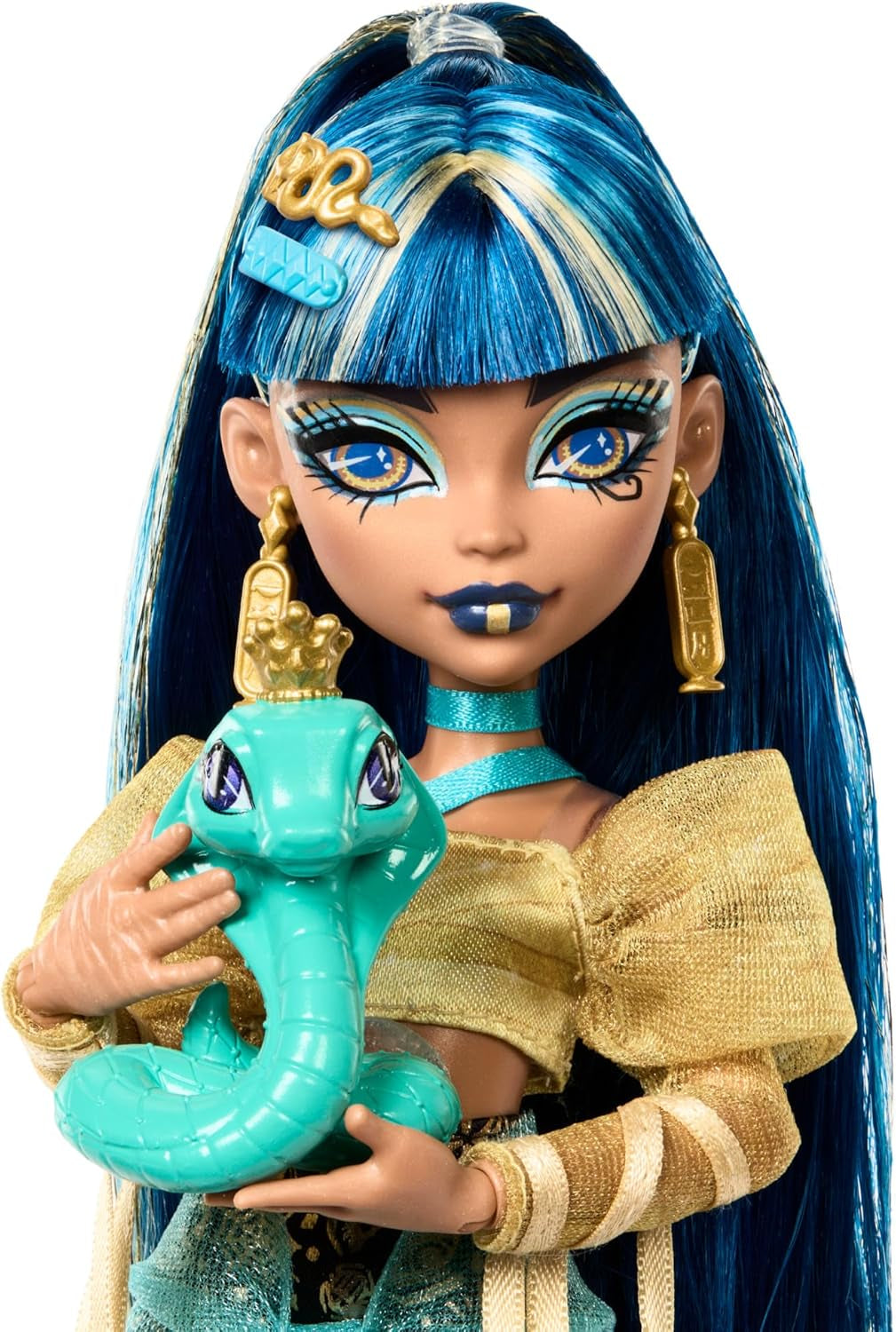 Poupée Monster High Cleo De Nile vêtue d'un chemisier doré et d'une jupe superposée, comprend le cobra Hissette et des accessoires tels qu'un cartable, une collation et un rouleau de papier toilette, HXH74