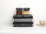 Boîte à pain Brabantia roll - Boîte de rangement compacte pour pain, bagels et petits pains avec couvercle plat, acier durable - taille moyenne - noir mat Boîtes de conservation alimentaire Naty Shop